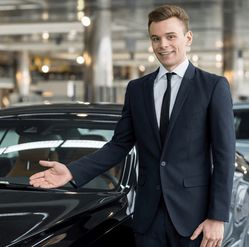 Professional chauffeur with luxury vehicle